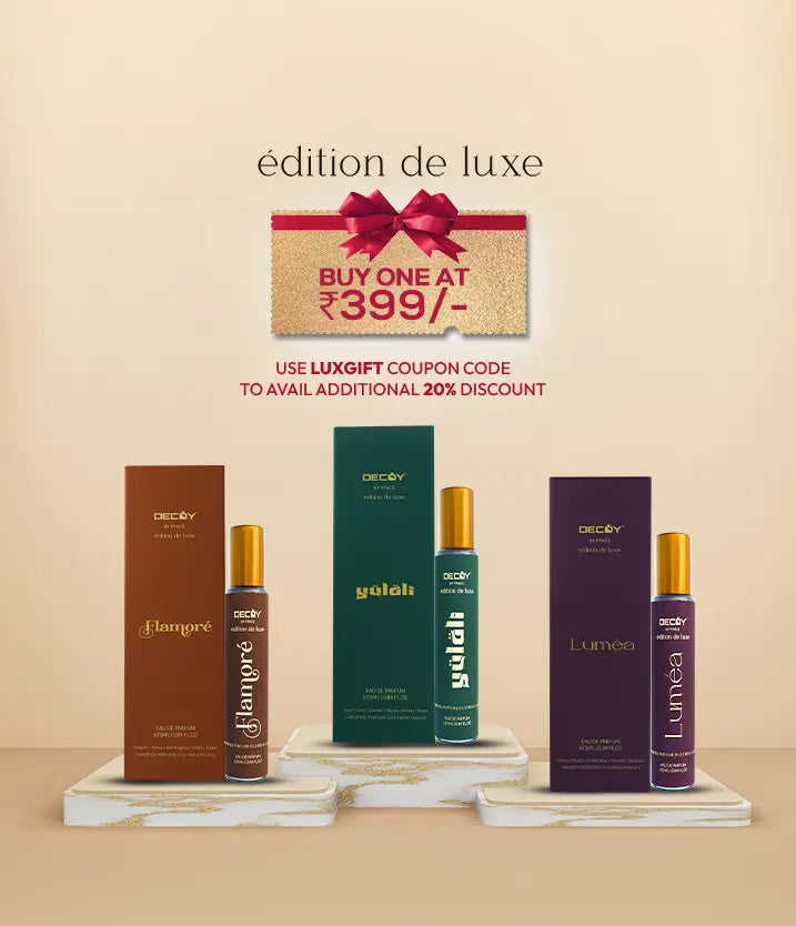 Decoy Édition de Luxe perfume bottles on podiums showing Buy One at ₹399 offer and additional 20% discount with code LUXGIFT.