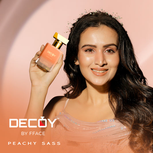 Decoy Peachy Sass 50ml travel size perfume model shot woman holding luxury floral fragrance