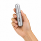 Hand holding a silver cylindrical product with 'DECOY' branding on a white background
