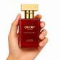 Hand holding a red perfume bottle with gold cap labeled 'DECOY by FFACE Passionate Red' on a white background