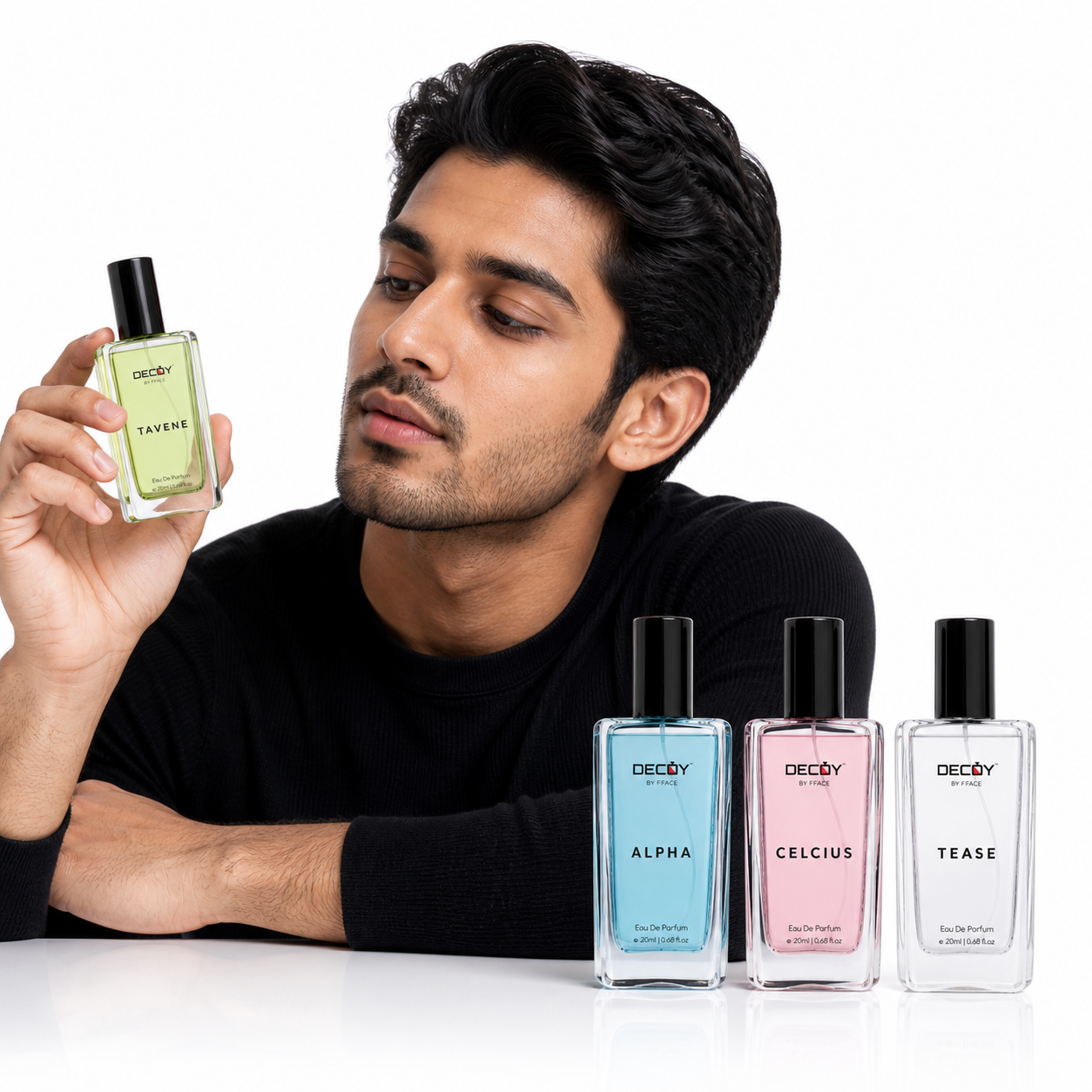 Man holding a Decoy perfume bottle with other Decoy perfume bottles displayed on a white background