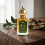 Perfume bottle with gold cap on a wooden surface