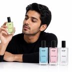 Man holding a Decoy perfume bottle with other Decoy perfume bottles displayed on a white background