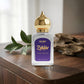 Perfume bottle with gold cap on a wooden surface