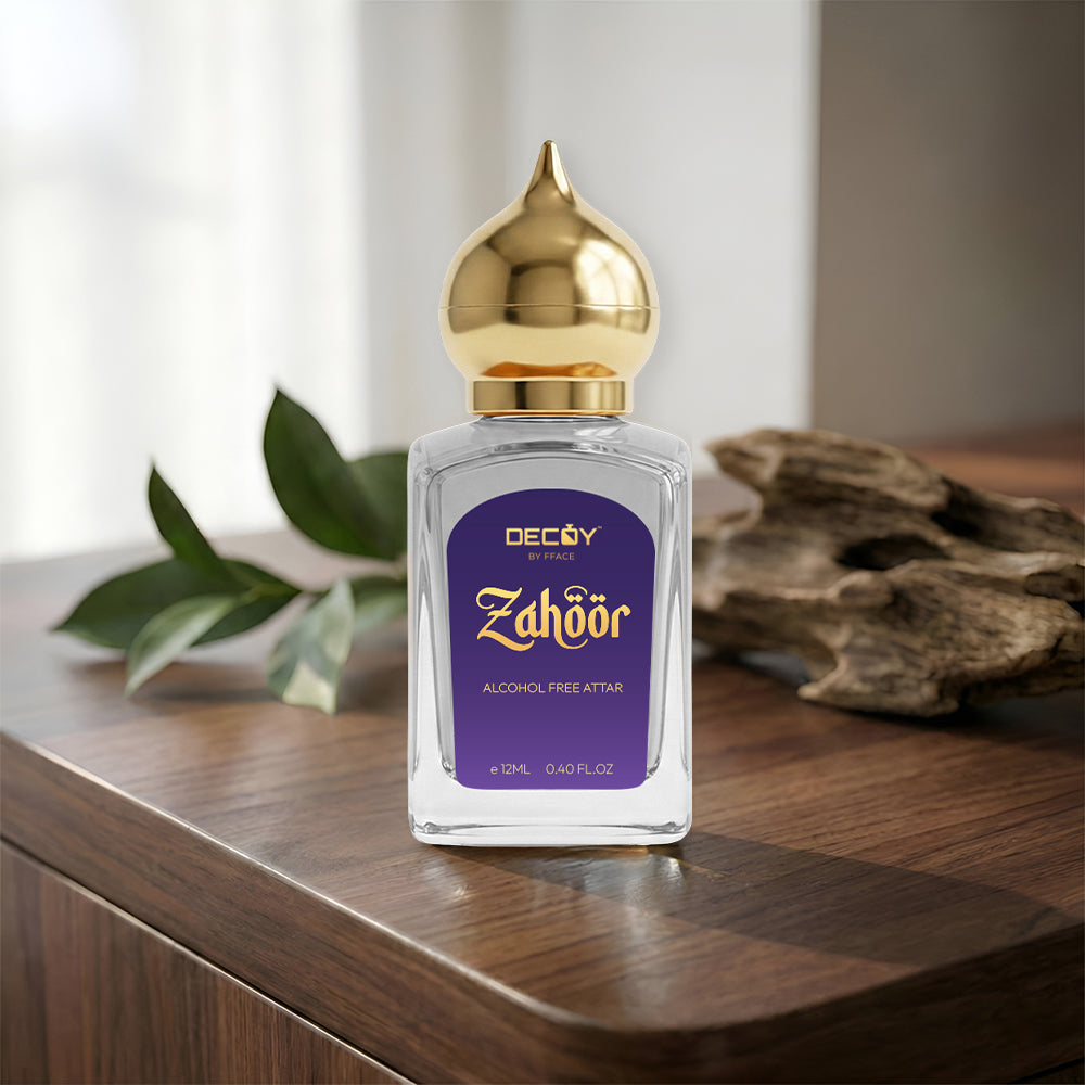 Perfume bottle with gold cap on a wooden surface