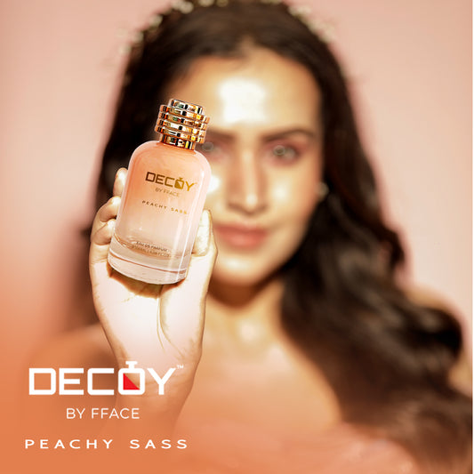 Decoy Peachy Sass 100ml perfume model shot woman holding luxury floral fragrance