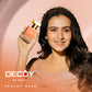 Decoy Peachy Sass 50ml travel size perfume model shot woman holding luxury floral fragrance